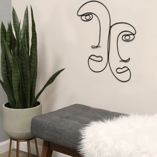 Kirkland's Home Metal Modern Outline Faces Wall Plaque- Wall Plaques