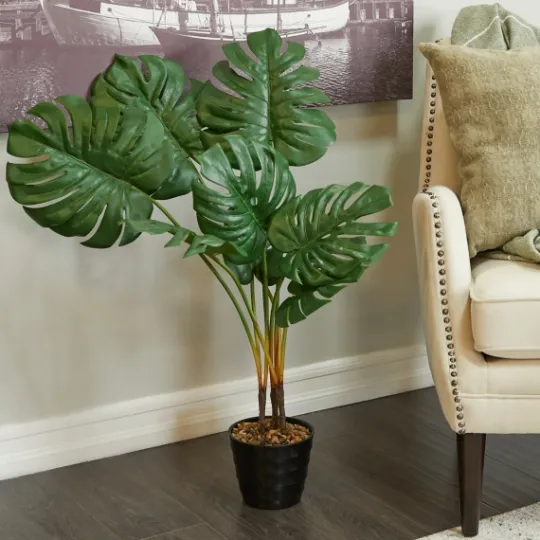 Kirkland's Home Monstera Plant In Ribbed Rock Planter- Trees & Topiaries
