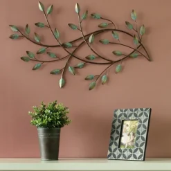 Kirkland's Home Patina Blowing Leaves Metal Wall Plaque- Wall Plaques